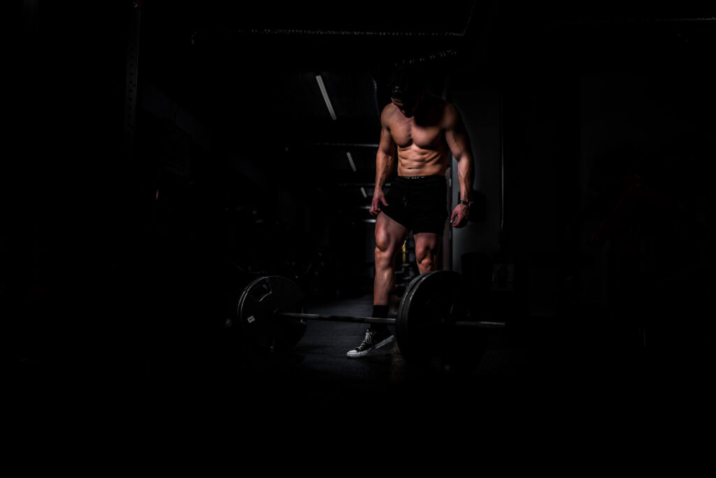 male body builder in gym showing body composition